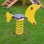 Yellow Seal rocking spring rider on playground grass.