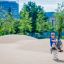 Child playing on Walrus rocking in a modern playground.