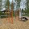 Outdoor fitness and training equipment set with climbing structures and wooden mulch ground. Perfect