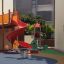 Double Pony rocking on colorful playground with red slide and play tower.