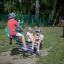 Children playing on Double Pony rocking at the playground.