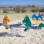 Double Pony rocking playground equipment in a sandy play area