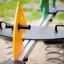 Double Pony rocking playground equipment with yellow and green seats on springs