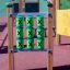 Tic Tac Toe playground equipment with green and black X blocks.