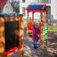 Child playing with Tic Tac Toe on playground equipment.