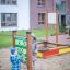 Children playing Tic Tac Toe on outdoor playground.