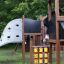 Children playing on Tic Tac Toe playground equipment.