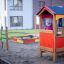 Child playing on Tic Tac Toe playground game set.