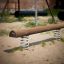 Balance wooden beam on springs in playground.