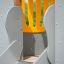 Elephant playhouse with slide featuring grey and orange panels.