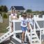 Children playing on a Small Ship sandbox playground.