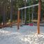 Nature Double Swing set in a forest playground.