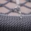 Close-up of Single Swing's woven rope seat and metal chain.