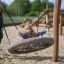 Child enjoying a Single Swing at a playground.