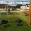 Double swing made from tires in a playground.