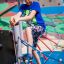 Child climbing on Starfish steel structure in playground.