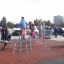 Children playing on Starfish steel structure in a playground.