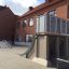 Quarter-Pipe high skate ramp in a schoolyard.