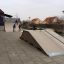 Quarter-Pipe high skate ramp with children playing