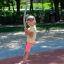 Spinner I playground equipment with a child playing outdoors