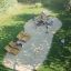 Children playing on the Tambora Eco playground equipment in a park setting.