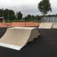 Double Quarter-Pipe skateboard ramp in outdoor skatepark.