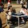 Children playing on a Merry-Go-Round at a playground.