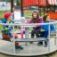 Children playing on Merry-Go-Round in a playground.