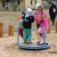 Children playing on the Bee playground equipment.
