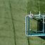 Sensory Box playground equipment with climbing and interactive elements viewed from above on green g