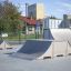 Skate park ramps, including the Combination 16 ramp, in an outdoor urban environment.