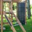 Climbing Kiosk Nature wooden playground equipment with climbing net and ladder for children in a gar