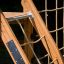 Wooden climbing equipment of the Climbing Kiosk Nature, featuring a rope ladder and net.