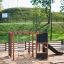 Outdoor playground structure named Climbing Kiosk Nature in a park setting.