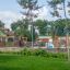 Children playing at the Romping Center Nature playground.