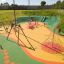 Children playing on the Medium Cableway in a colorful playground.