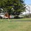 Medium Cableway in a park setting with green grass and trees.