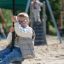 Silver Cableway playground zip line with child sliding in outdoor park
