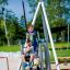 Two boys playing on Silver Cableway at a playground.