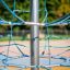 Powerclimber climbing net playground equipment.