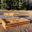 Wooden Sandbox in a Park with Benches.