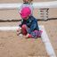 Children playing in Sandbox at playground.