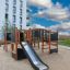 Square Play Nature - wooden playground equipment with slides, ladders, and climbing nets