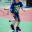 Boy playing on Surf Board playground equipment