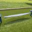 Surf Board playground equipment on grass.