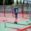 Boy balancing on Surf Board at playground.