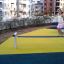 Child balancing on Surf Board playground equipment.