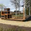 Wooden Ship Nature Sandbox playground structure for children.