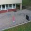 Children's playground equipment named Bridge installed in a sandy area.