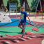 Children playing on the Bridge playground equipment in an outdoor play area.